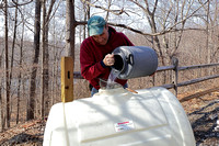 170223_0486_EOS M5 Teatown Volunteer Rudy Fasciani Fills the Sugar House Supply Tank with Sap Collected from the Sugar Maples