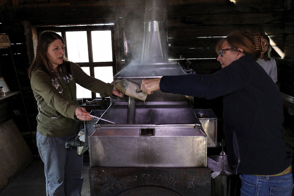 170223_0471_EOS M5 Teatown Educator Maggie Pichura and Director Phyllis Bock Sample the Maple Syrup for Density Testing with a Hydrometer